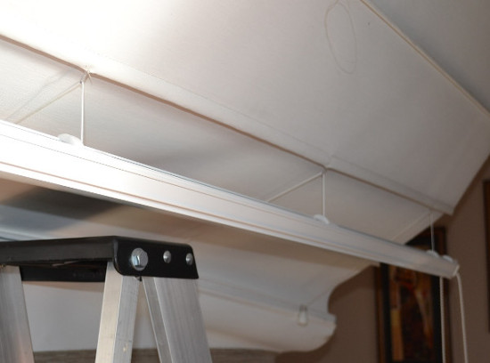 Roman blind head rail hangs free